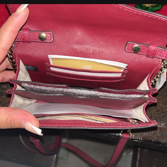 Burgundy Michael kor side bag.